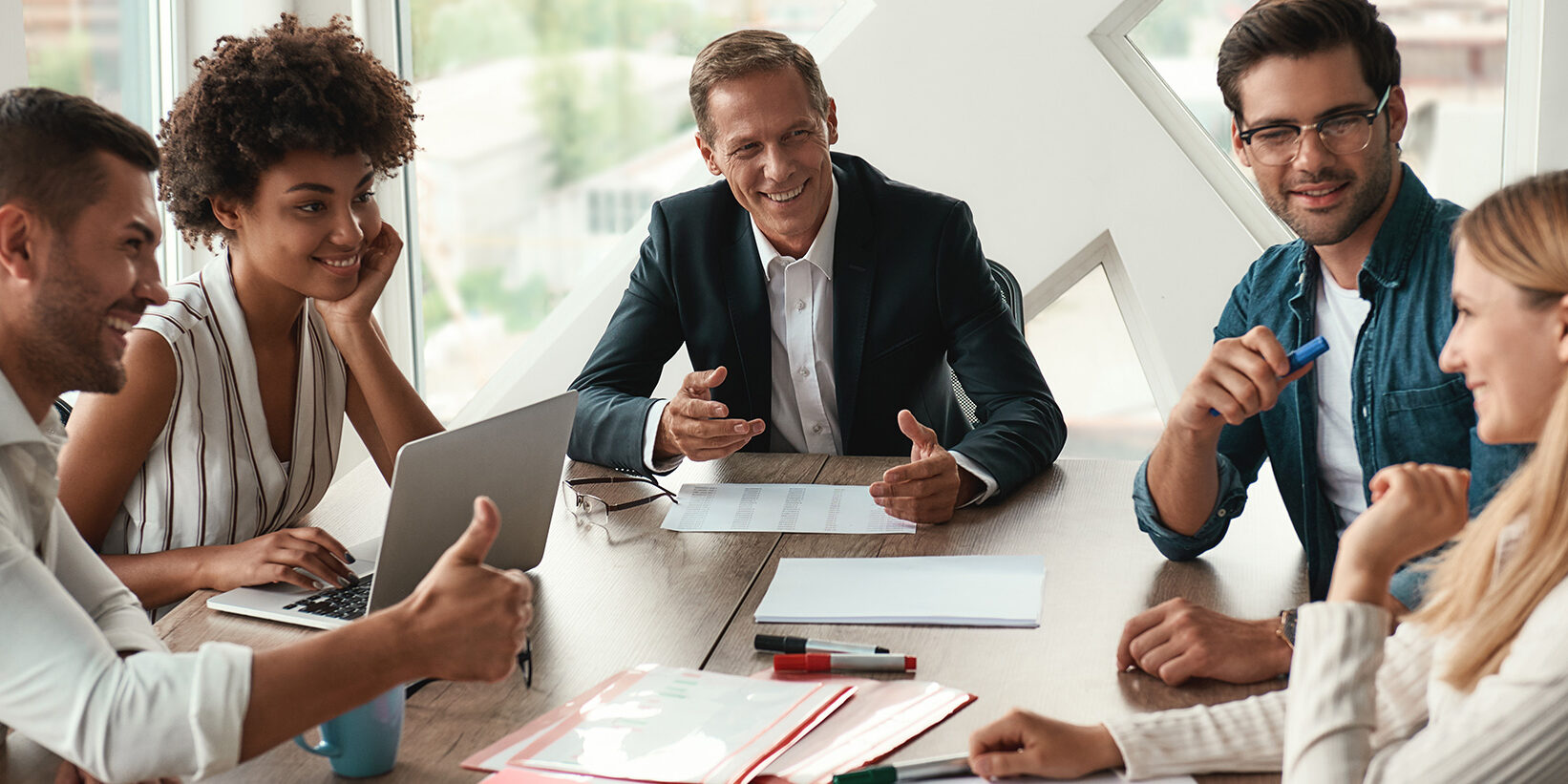 Group discussing ideas around a table.